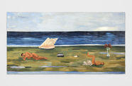 people lay on a grassy beach with sail boat in the background