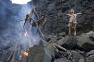 Girl celebrates creating a campfire