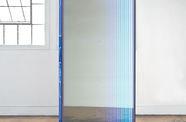 Blue door with lighting around the edges has a fantasy mirror like quality