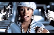 Missy Elliott, surrounded by hands holding cell phones to her face