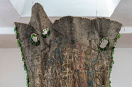 Large hanging artwork made from found materials
