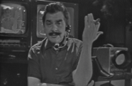 Ernie Kovacs speaking into a headset