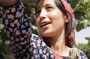 Close up of a woman wearing a scarf over her hair