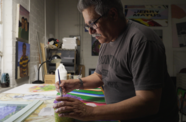 Joey Terrill working in his studio
