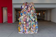 Sculptural installation covered with ceramic hands