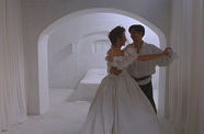 Still from White Room, with a couple dancing in a white room