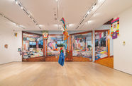 Gallery view full of bright fabrics and clothing