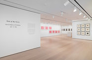 installation image of works on paper framed on walls