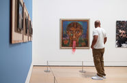 A man viewing art in a gallery
