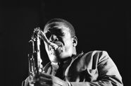 John Coltrane plays his sax