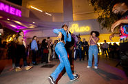 A woman dancing in the Hammer Museum courtyard