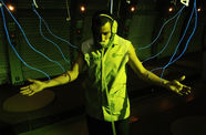 A man wired to a cybernetwork through nodes attached to his arms