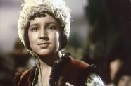 Image of a young boy wearing a furry hat