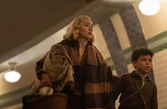 Saoirse Ronan & Elliott Heffernan walk together, holding a picnic basket and blanket