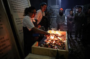 A chef lights an outdoor grill