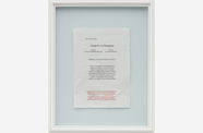 a framed piece of paper writing