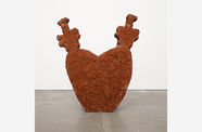 a cement sculpture in the shape of a heart 
