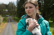 A young girl holds a bunny