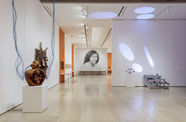 Installation view of a gallery with a large-scale photograph of Alice Coltrane