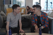 Chase Strangio and Elliot Page smile at each other