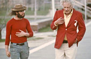 still of two men walking and talking
