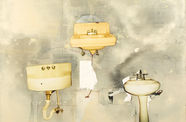 Three dingy sinks arranged in a triangle on a gray wall