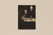 Simple self-portrait of a woman sitting at a desk under a lamp