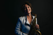 Kasey Knudsen holding a saxophone