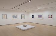 Gallery with works on paper installed on the wall and on a plinth