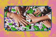Close up of hands playing mahjong