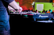 Closeup of a DJs hands working his turntables