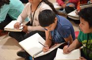 Kids writing in the galleries