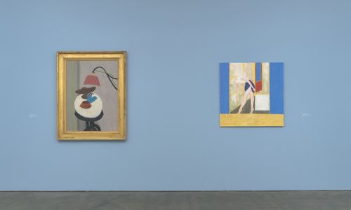 Two paintings hang on a blue gallery wall