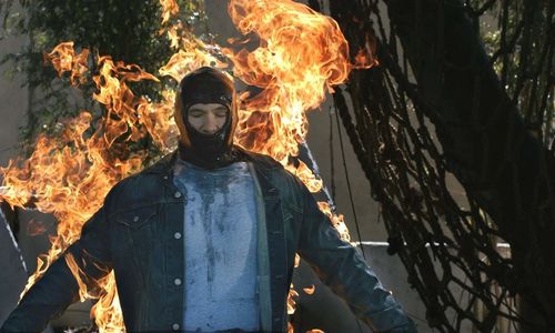 A man in a mask is on fire