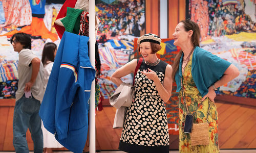 Two women look at an art installation