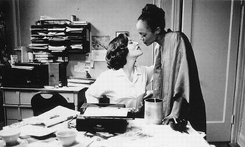 Two women prepare to kiss