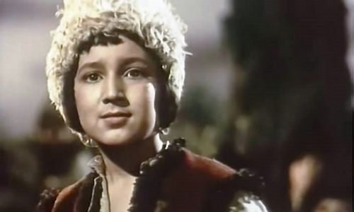 Image of a young boy wearing a furry hat