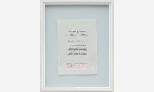 a framed piece of paper writing