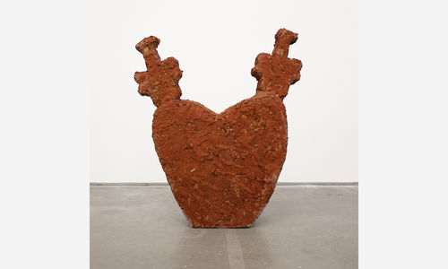 a cement sculpture in the shape of a heart 