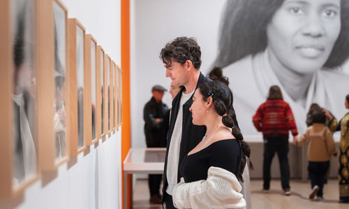 Museumgoers looking at art