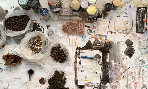 Overhead view of art materials on a table 