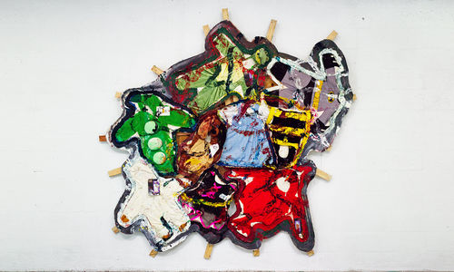 Oddly shaped painting covered with kids Halloween costumes