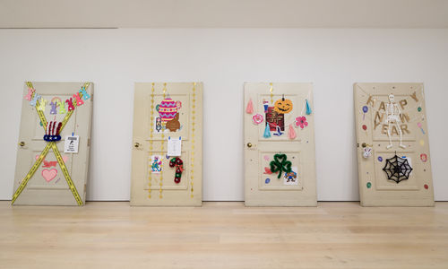 Four hugely oversized doors decorated in the style of the seasons