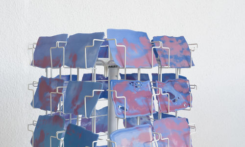 Postcard rack stocked with postcard-sized images of the sky