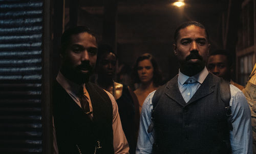 Identical twins played by Michael B Jordan look just off camera