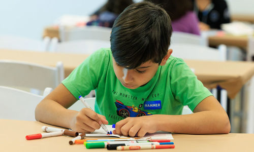 image of boy writing