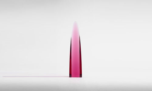 Pink object against a white background