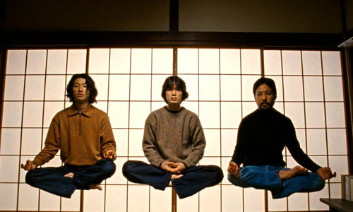Three figures levitating while sitting cross-legged