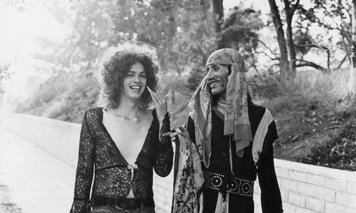 Two men in androgynous costumes