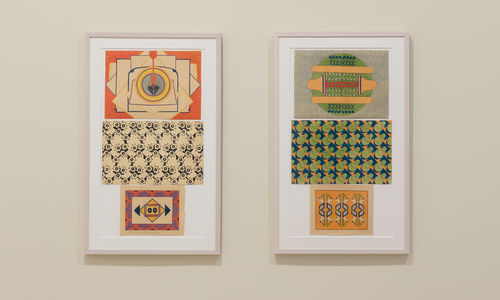 Two framed artworks on a wall with colorful geometric patterns